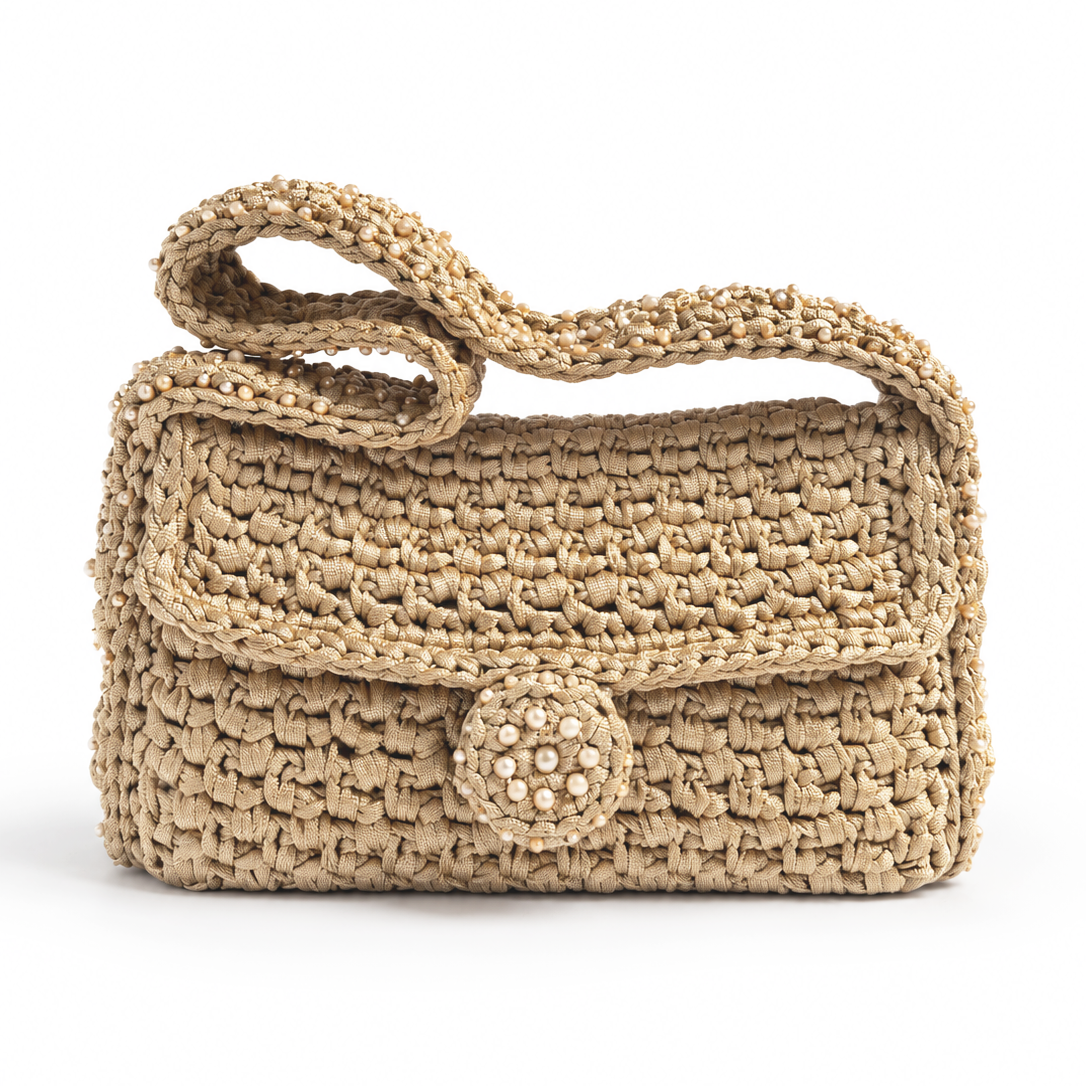 Borsa Talide champagne con manico ripiegato, patta frontale e decorazione circolare con cristalli.